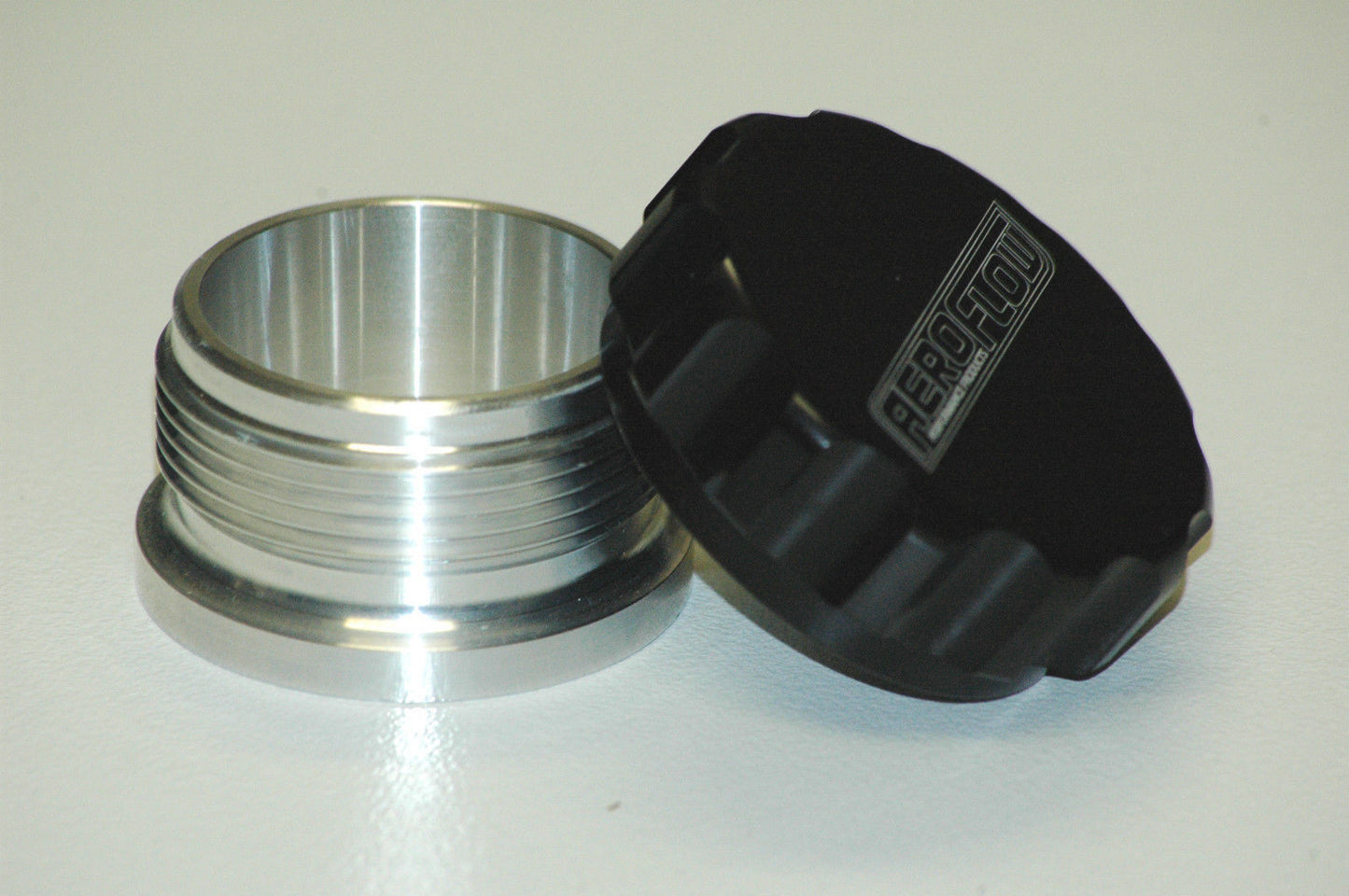 Aeroflow AF460-24BLK 1.5" Alum Weld Bung & Cap Raw Weld On / Black Cap