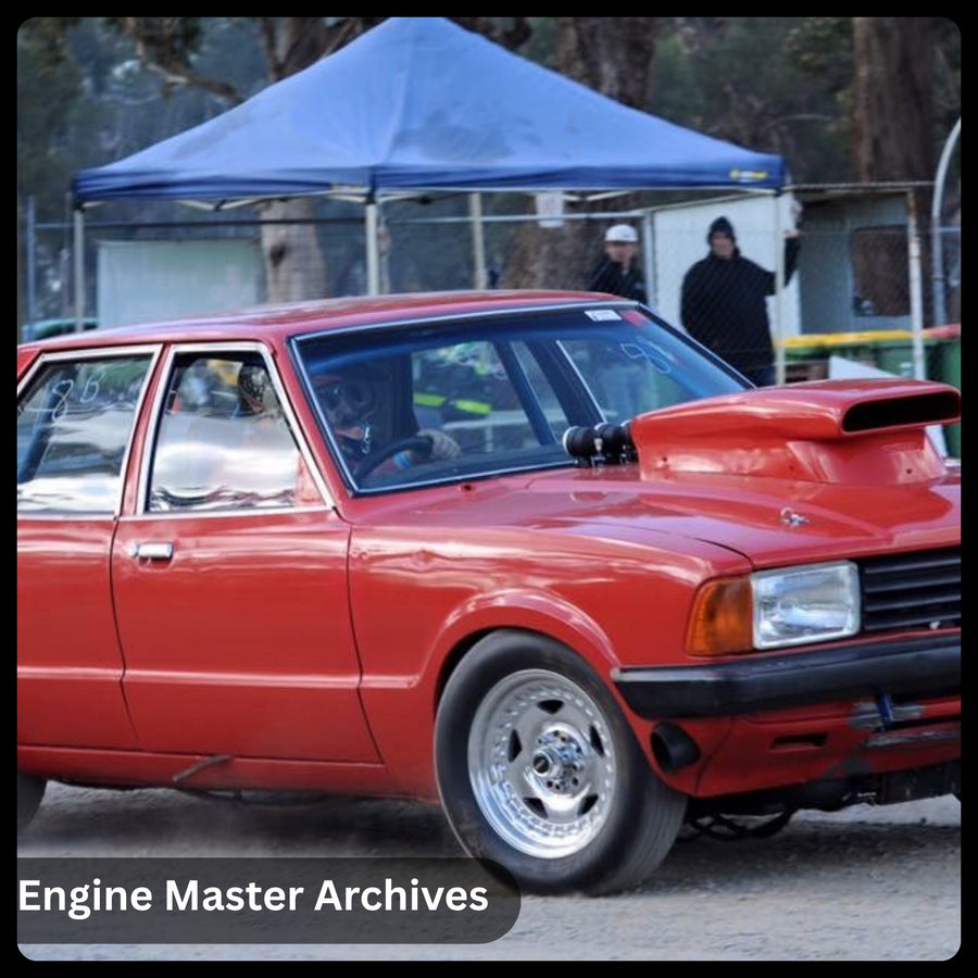 A red classic at a car show